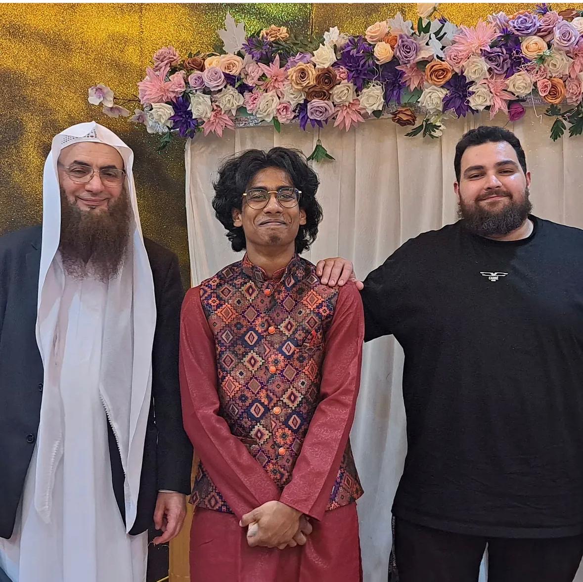 The groom with the celebrant and his witness